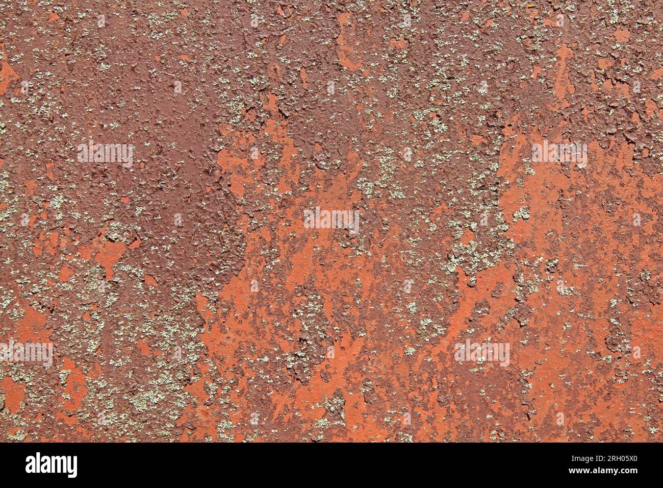 Rusted metallic background, texture. An old red and rusty surface with faded uneven color. Abstract rust pattern on light-brown metal surface Stock Photo