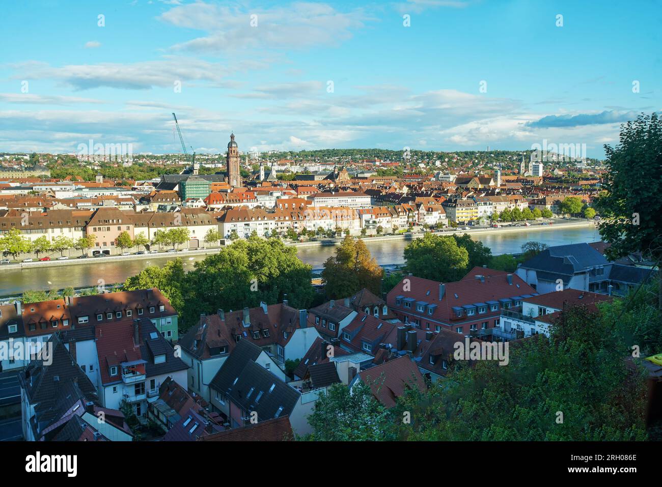 Fairy tale view  on Pedestrian old Main bridge (Mainbrucke) and Main river  in Wurzburg and cityscape with red tiled roofes in Bavaria in early autumn Stock Photo