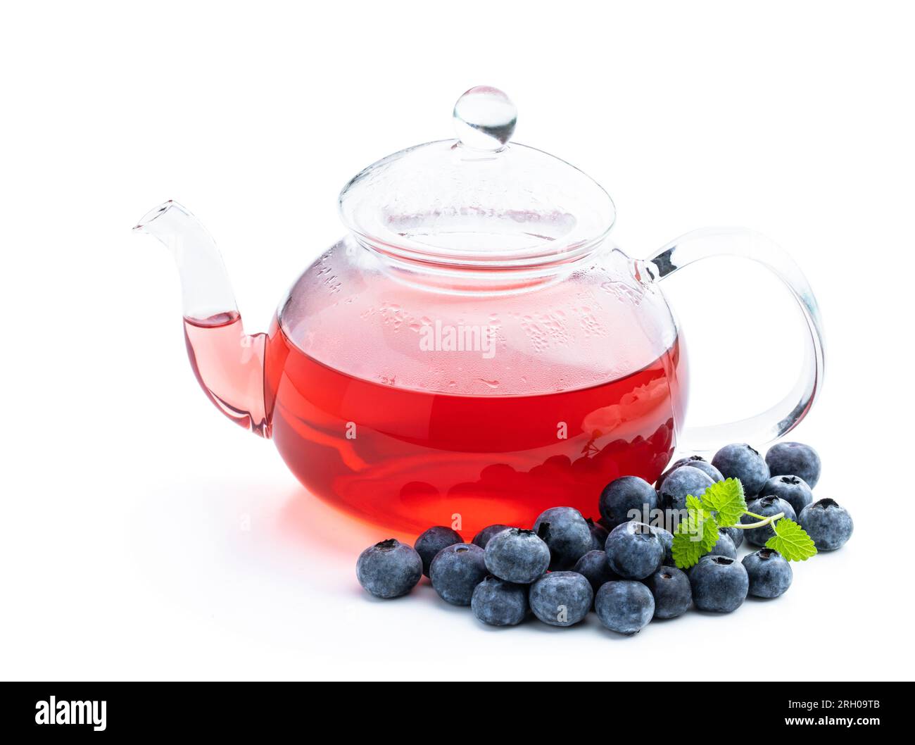 Blueberry  tea in glass teapot isolated on white background Stock Photo