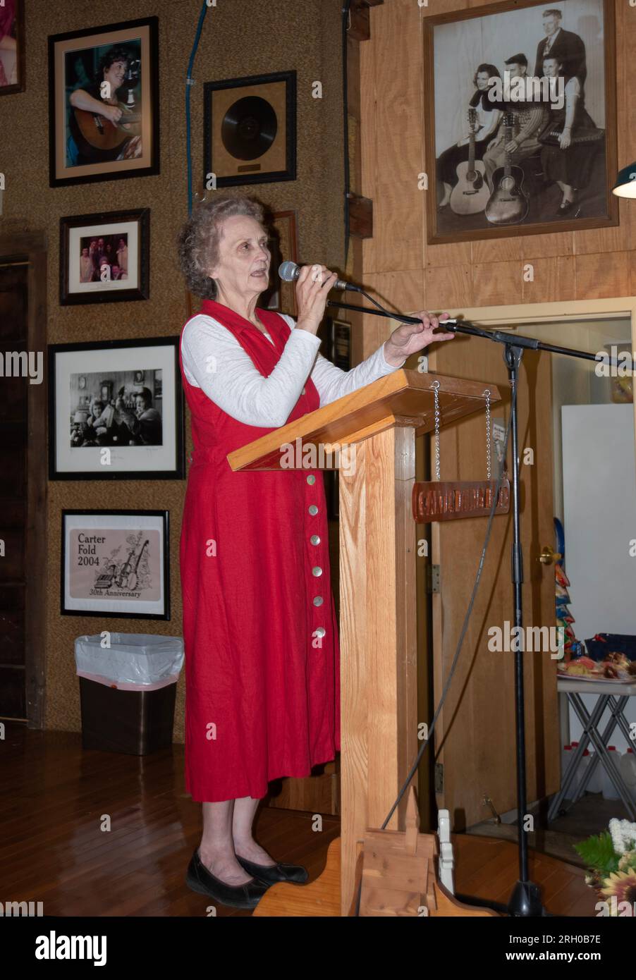 Rita Forrester, manager of The Carter Fold in Southwest Virginia, introduces a band performing at the concert venue. (see additional info) Stock Photo