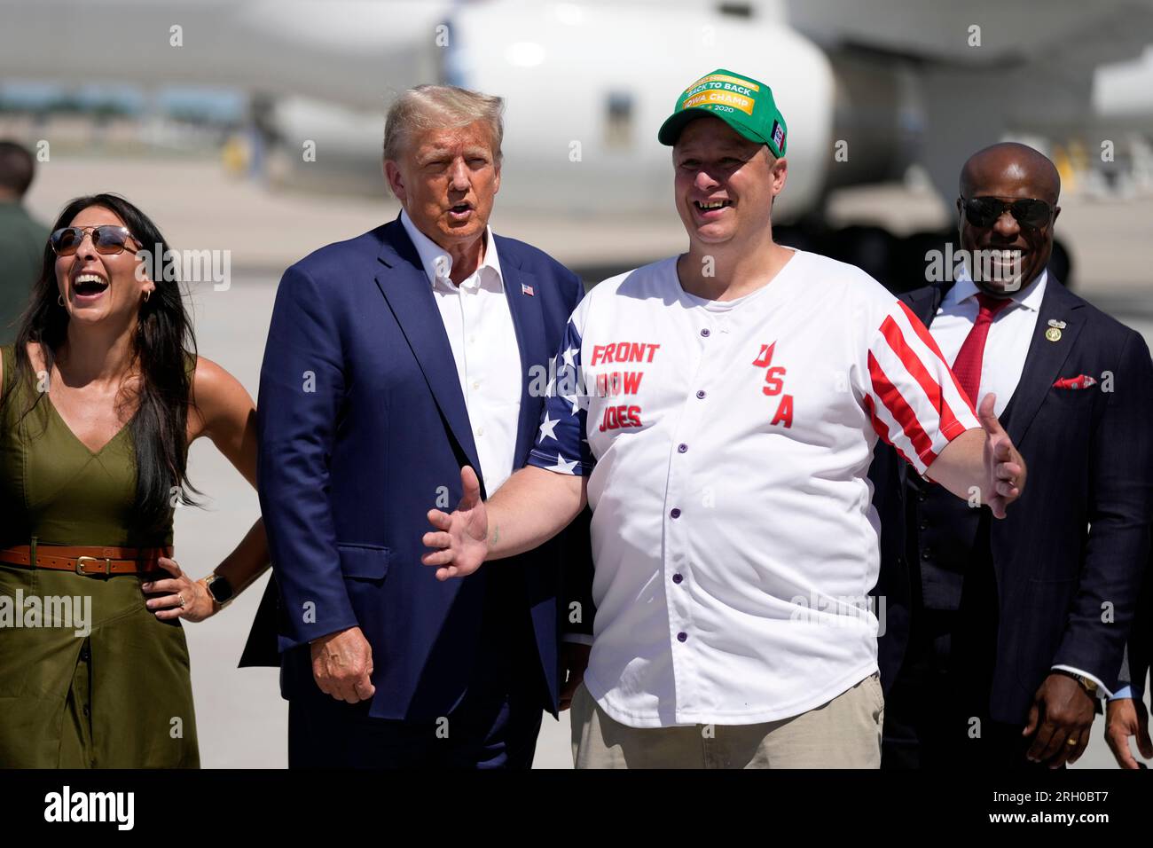 Republican presidential candidate former President Donald Trump greets