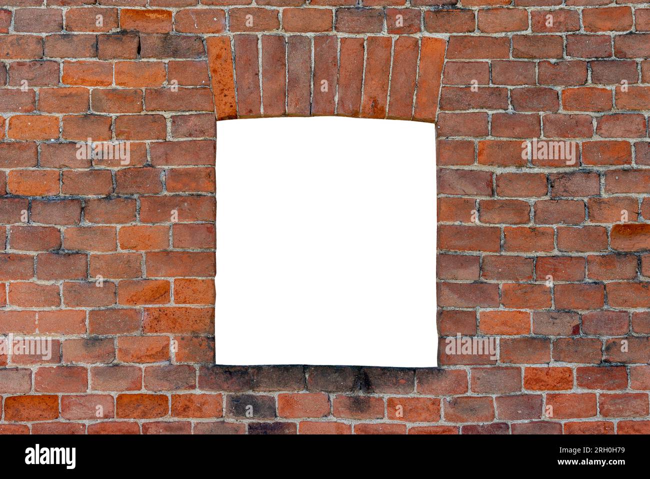 Antique brick window on red brick wall. Elements of architectural decoration with clipping path included. Red brick frame. Space for copying Stock Photo