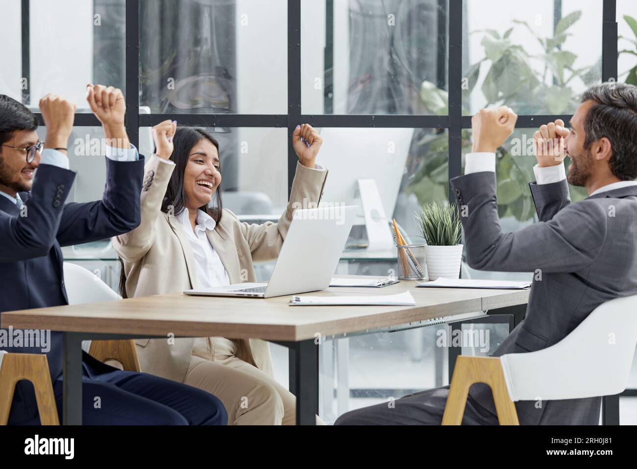 teamwork success win triumph concept at conference table Stock Photo