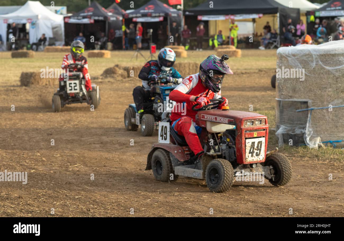 Racing lawn mower drivers speed along in the BLMRA 500, a Le Mans style ...