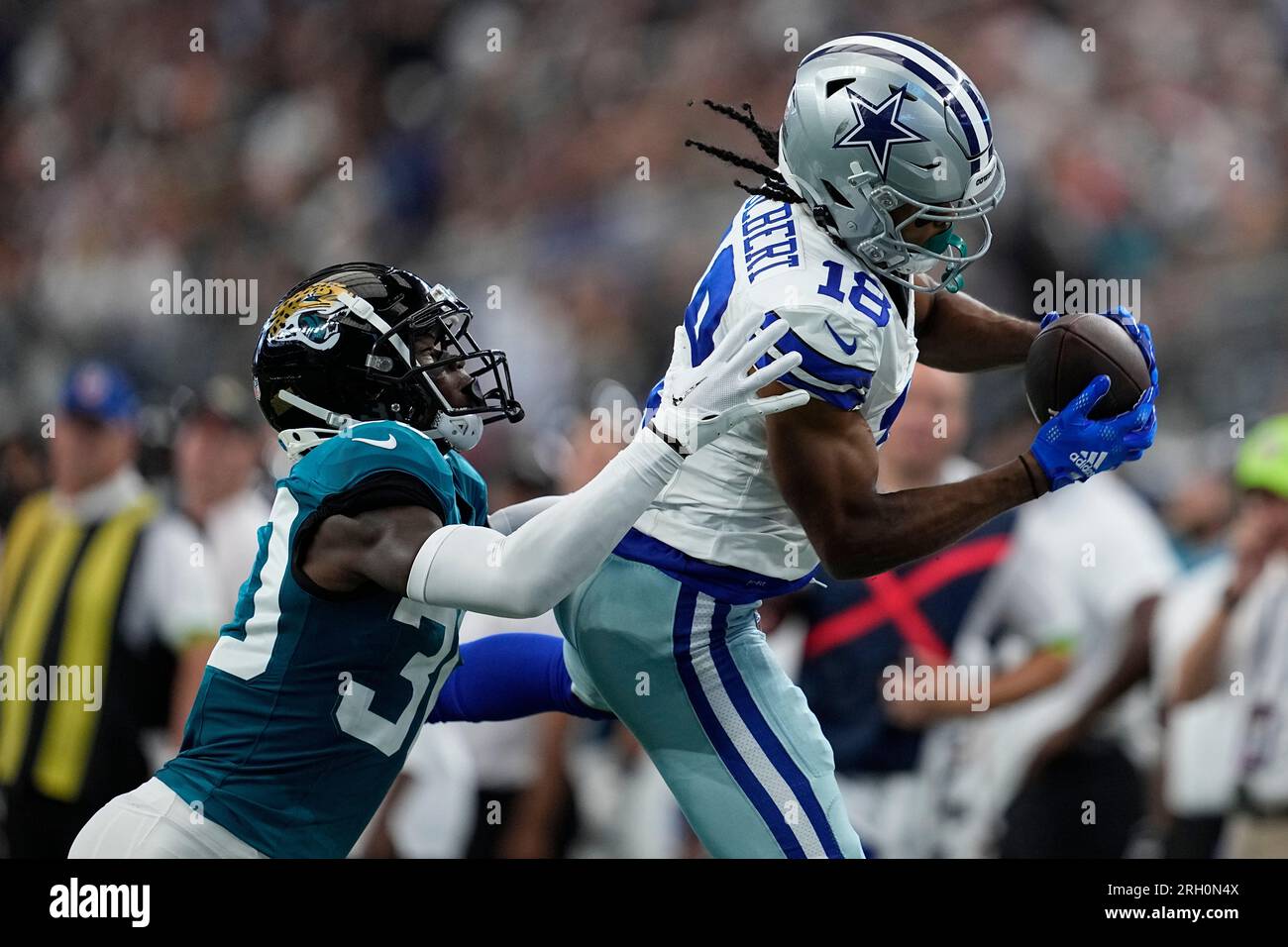 Dallas Cowboys wide receiver Jalen Tolbert (18) catches the ball against  Jacksonville Jaguars cornerback Montaric Brown (30) and play comes back  with a penalty during the first half of an NFL preseason