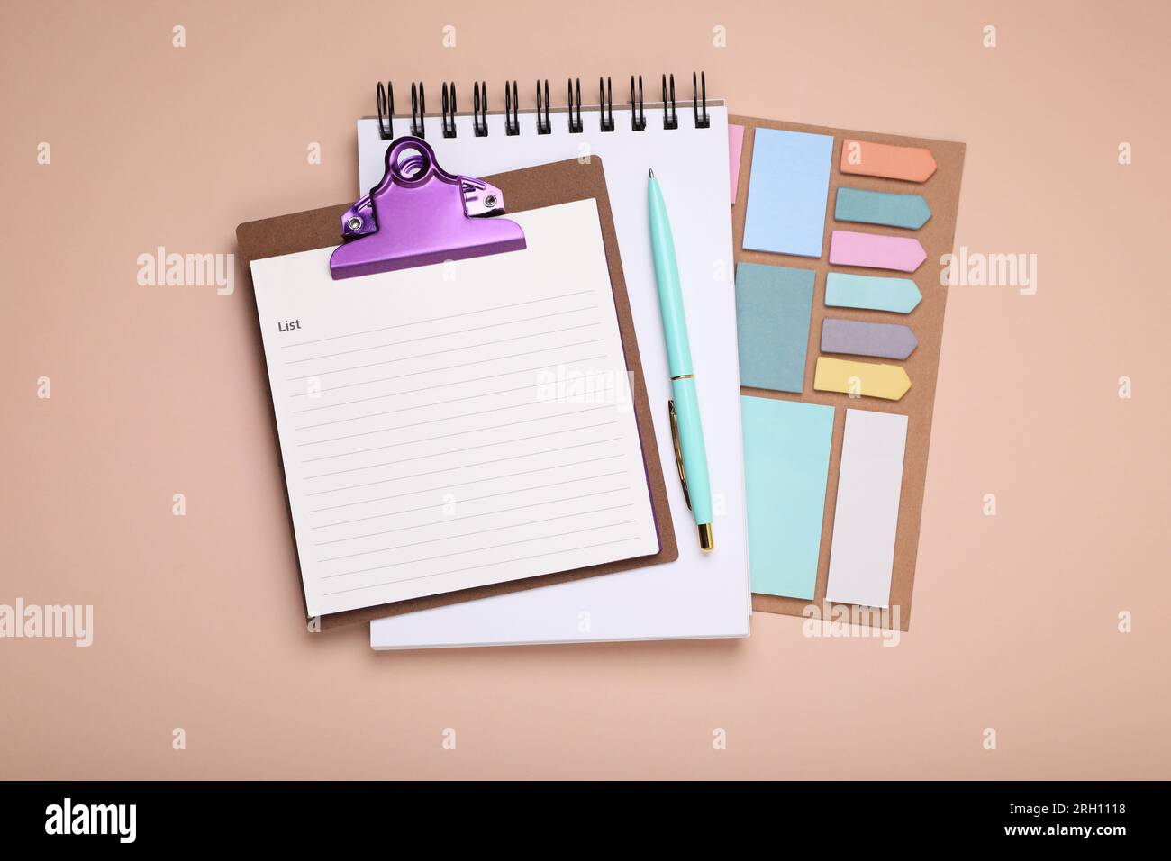 Mini clipboard with to do notes, notebook and stationery on beige background, flat lay with space for text. Daily planning Stock Photo
