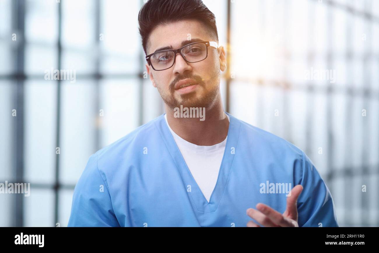 young male wearing with stethoscope speaking, consulting and therapy concept Stock Photo