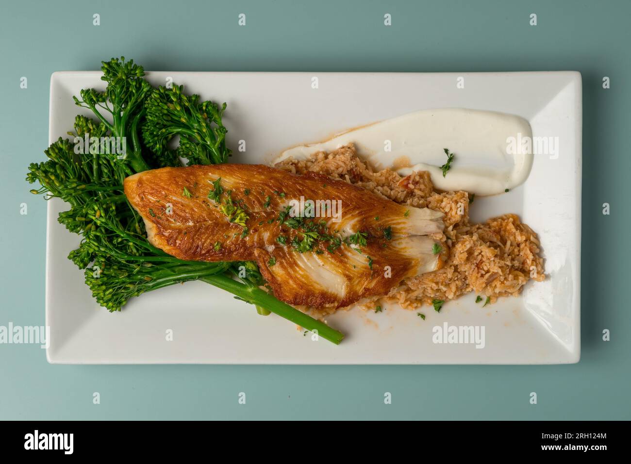 Fried fish and broccoli Stock Photo