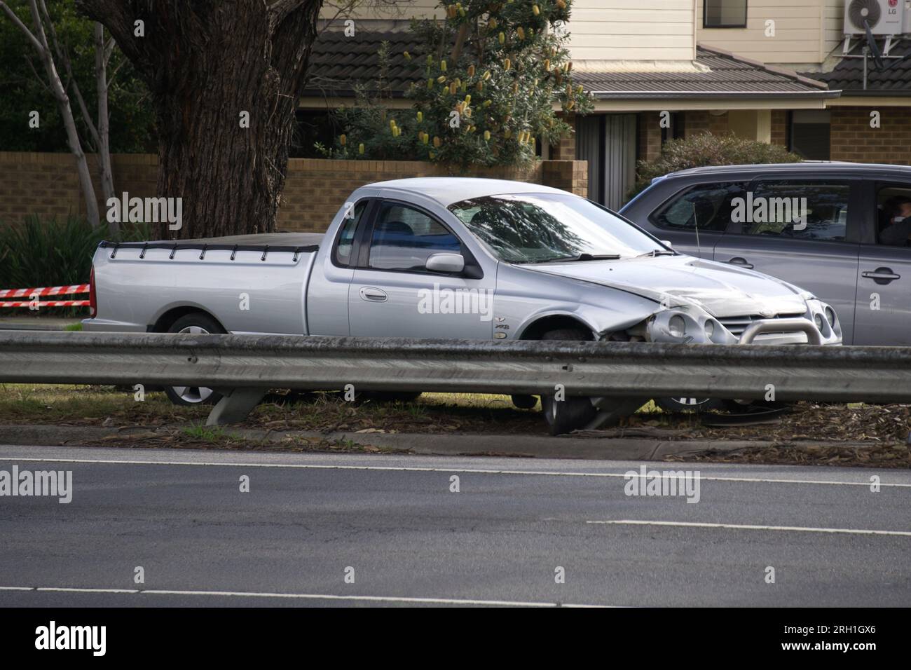 Belverde Park Victoria Australia 13th August 2023, Side view of XR8 Falcon Ute lost control and collided with a guard rail on the median strip Frankston Dandenong road. credit PjHickox/Alamy Live News Stock Photo