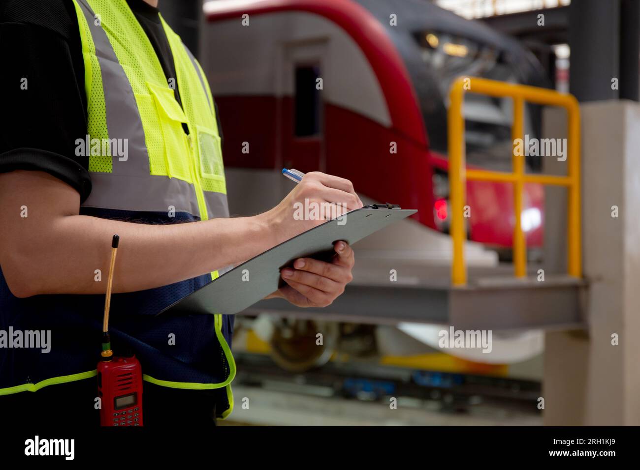 Checking Engineering Document Closeup hands of engineer man or worker checking electric train for ...