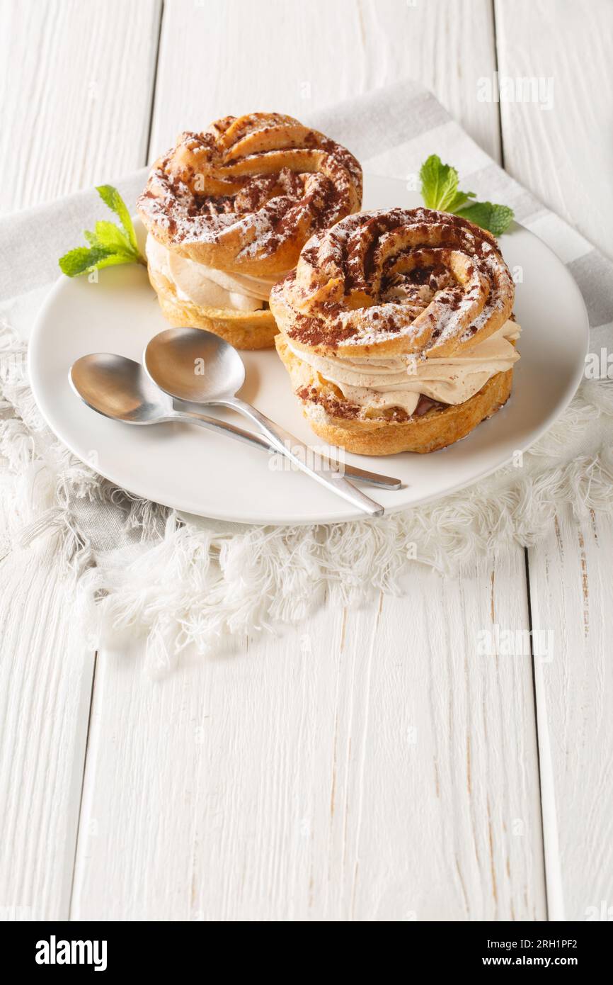 French Dessert Paris Brest With Powdered Sugar And Cocoa Closeup On A