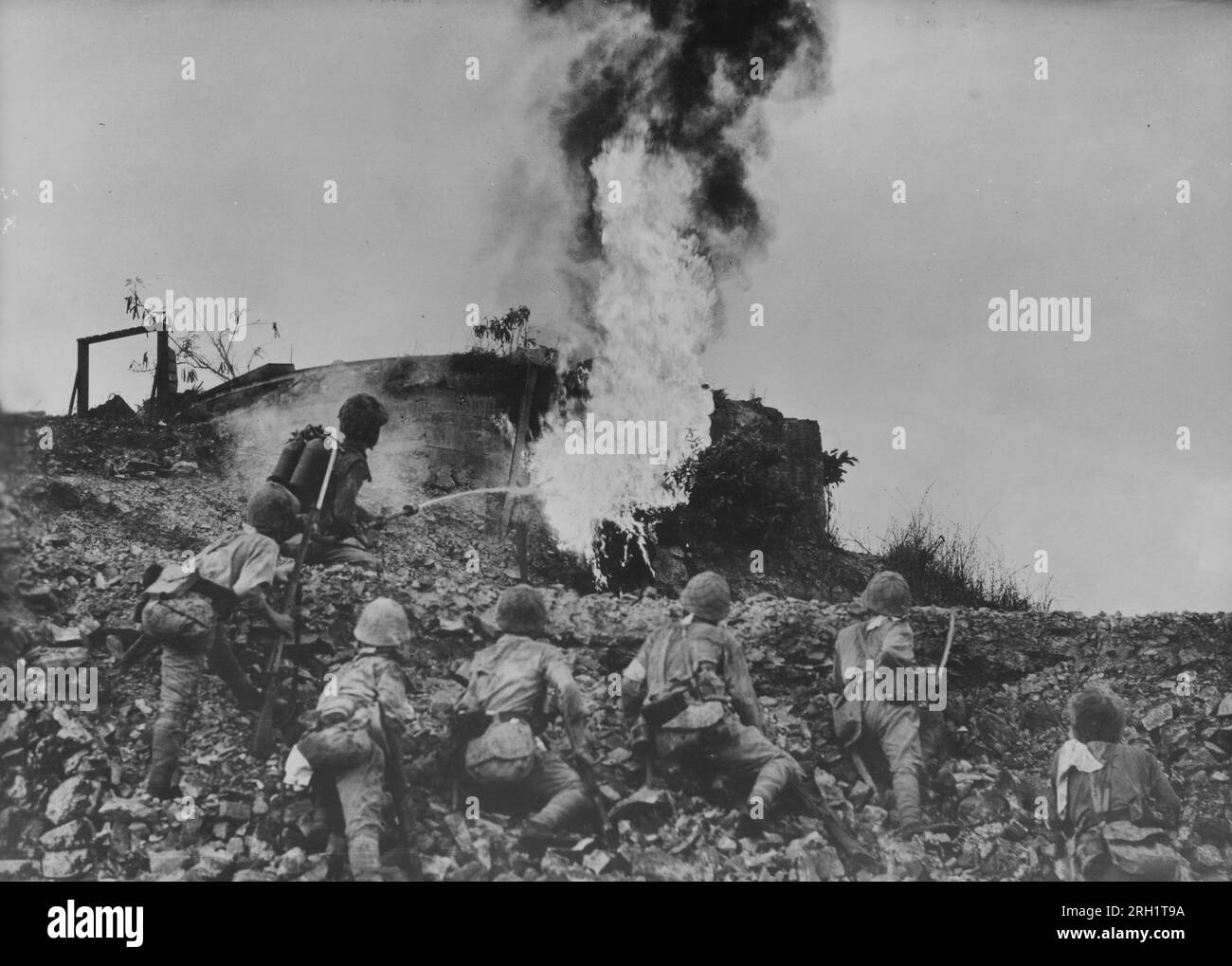 Invasion of the Philippines, December 1941 – May 1942. Imperial Japanese Army troops scorch an Allied pillbox with a flamethrower during the Battle of Bataan, January 7 – April 9 1942. Stock Photo