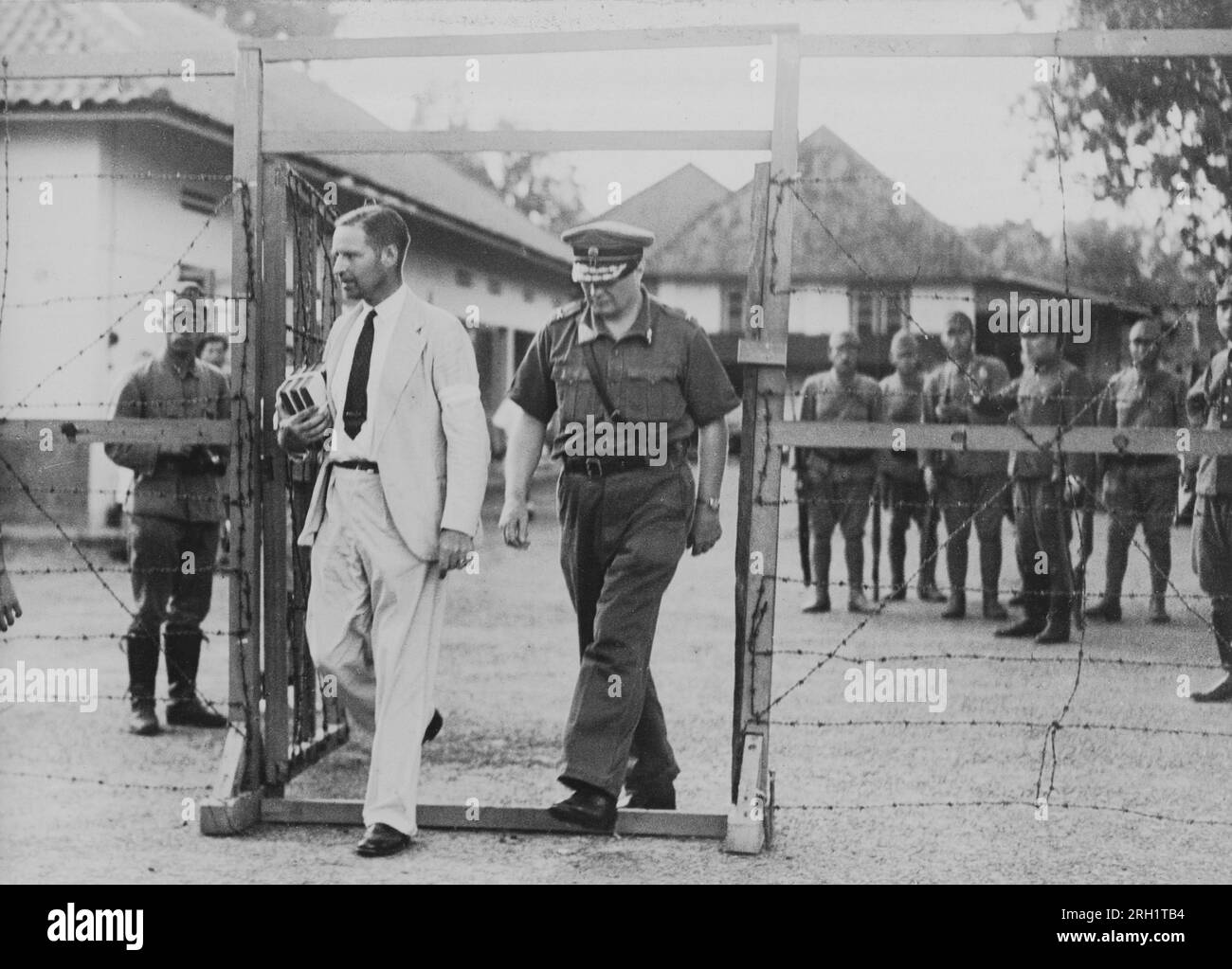 Dutch East Indies Campaign, December 1941 – March 1942. Following the fall of the Dutch East Indies to the invading Imperial Japanese Sixteenth Army, Governor-General Tjarda van Starkenborgh Stachouwer (left) and Lieutenant-General ter Poorten are taken prisoner and escorted into a Japanese internment camp in Batavia, March 1942. Stock Photo