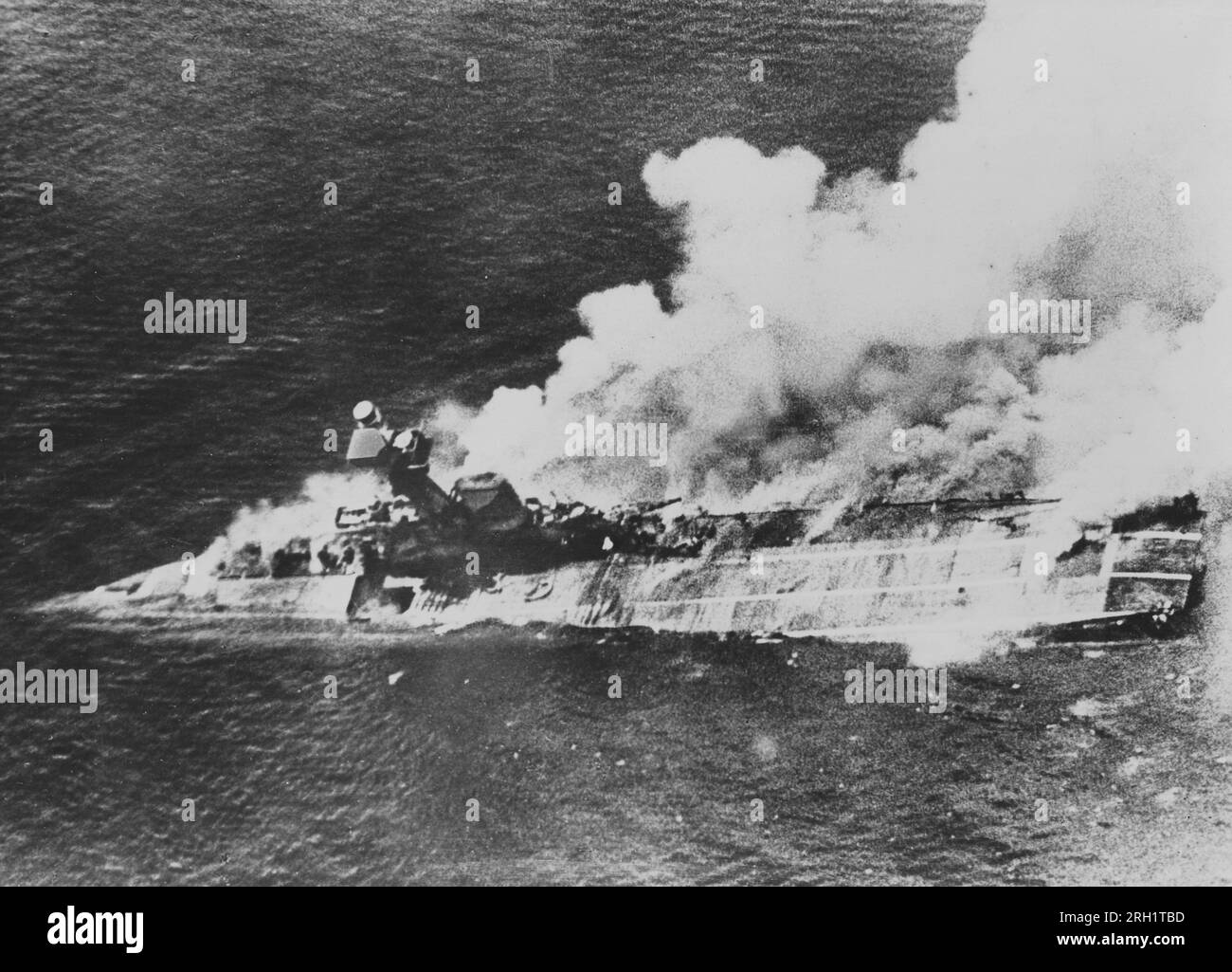 Indian Ocean Raid, March 31 – April 10 1942. Smokes billows from the sinking Royal Navy aircraft carrier HMS Hermes in the aftermath of an attack from Imperial Japanese Navy aircraft, April 9 1942. Stock Photo
