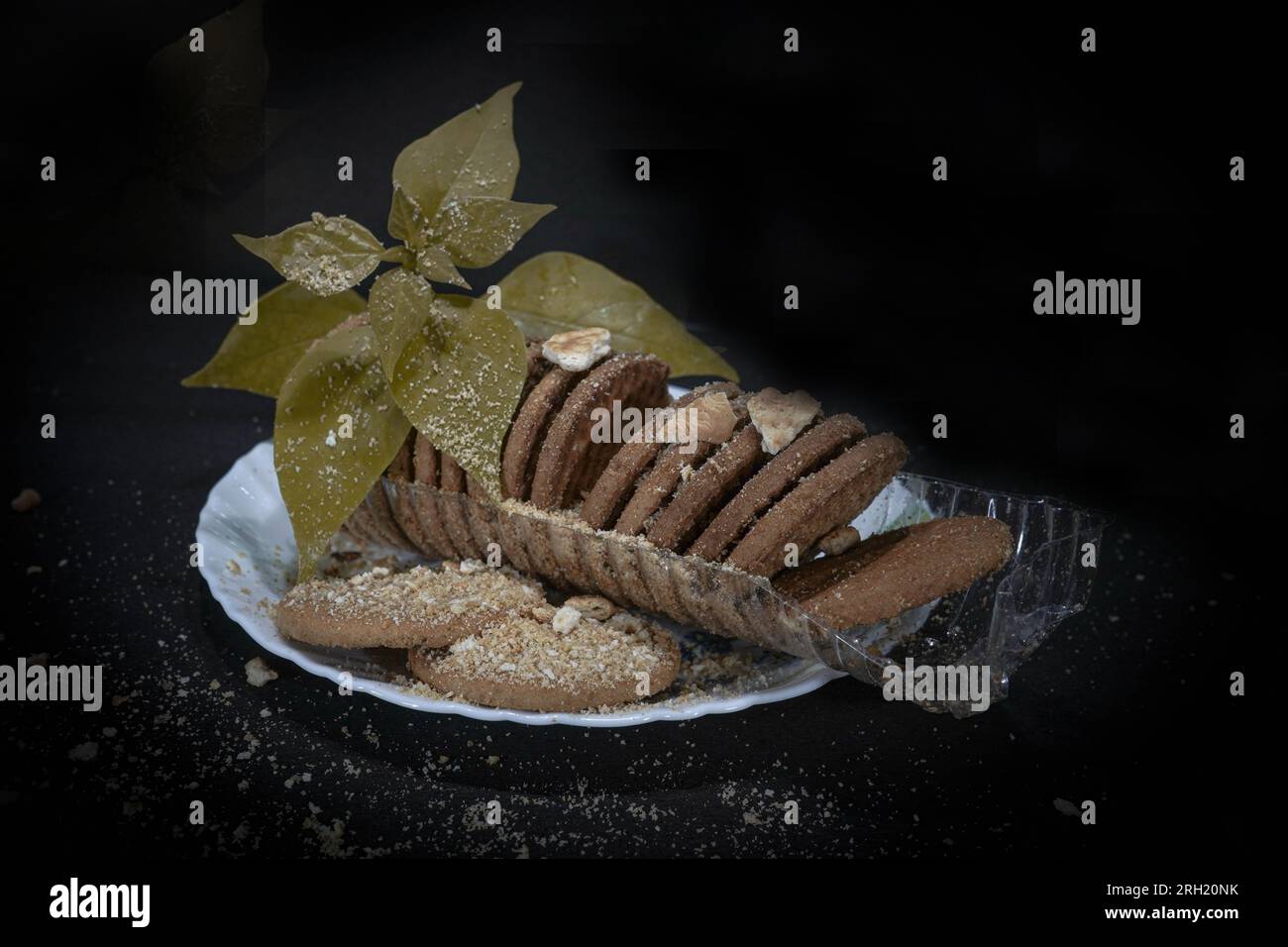 Wheat biscuits in the white melamine plate with black background. Indian biscuits popularly