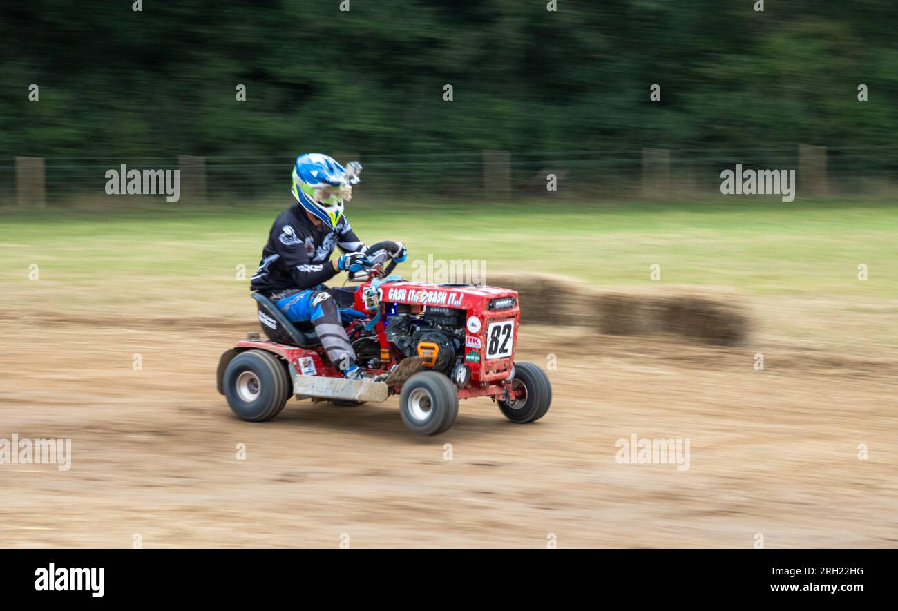 A Racing Lawn Mower Driver Races At Dawn In The BLMRA 500 A Le Mans a-racing-lawn-mower-driver-races-at-dawn-in-the-blmra-500-a-le-mans