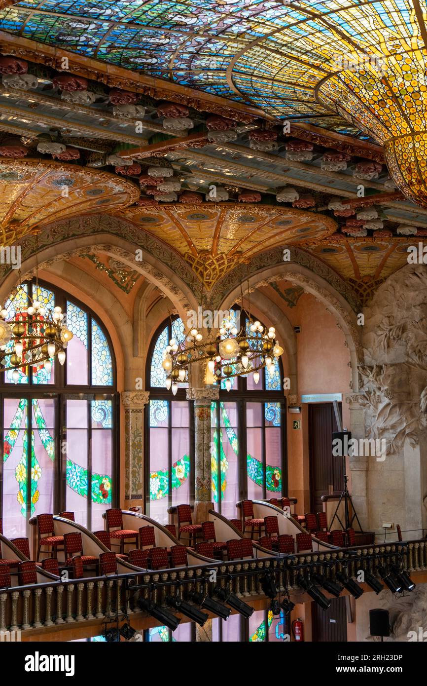 close up of concert hall chairs and colourful ceiling of Palau de la Musica Catalana Stock Photo