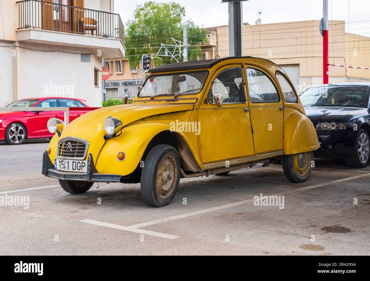 Manacor, Spain; july 21 2023 Yellow Citroen 2 CV car, parked on the