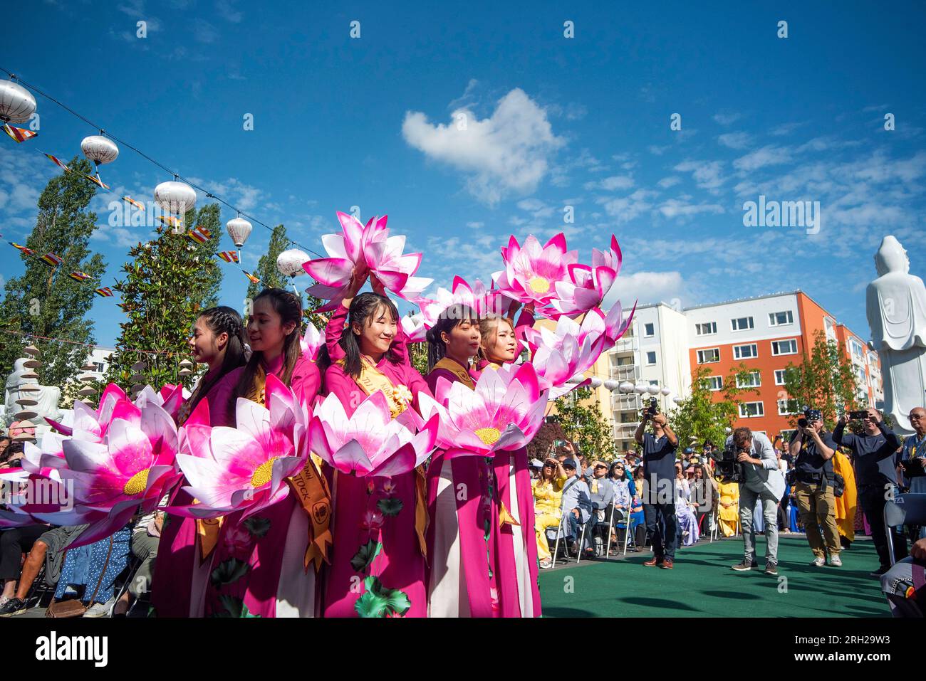 Rostock, Germany. 13th Aug, 2023. Women show a dance during the inauguration of the temple Loc