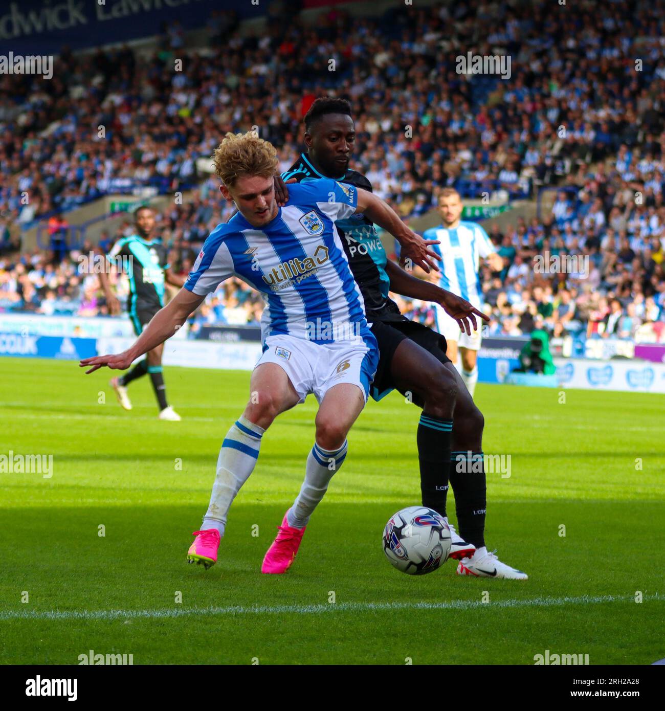John Smith's Stadium, Huddersfield, England - 12th August 2023 Jack Rudoni (8) of Huddersfield Town and Wilfred Ndidi (25) of Leicester City fight for possession of the ball - during the game Huddersfield Town v Leicester City, Sky Bet Championship,  2023/24, John Smith's Stadium, Huddersfield, England - 12th August 2023 Credit: Mathew Marsden/WhiteRosePhotos/Alamy Live News Stock Photo