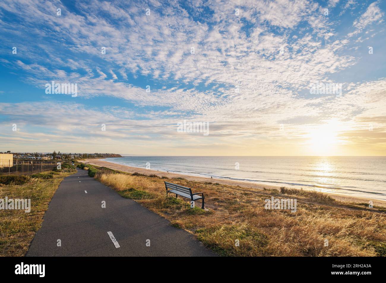 Bike lane with sea view along Christies Beach at sunset, South Australia Stock Photo