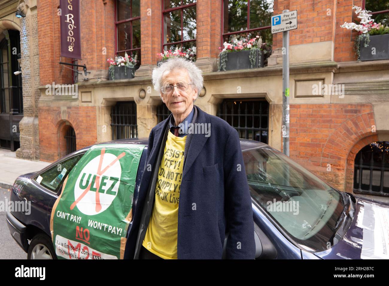 Manchester, UK. 12th Aug, 2023. Piers Corbyn joined a crowd of approximately 80 people turned  on 12th of August 2023 to mark the Peterloo massacre of 16th of August 1819 which took place in Manchester. Organisers blamed a rival 'Peterloo March for democracy' event which is organised for the 19th of August 2023, plus other protests and events including the Manchester Caribbean carnival, a Trans right protest and a Iranian proregime change protest in St Peters square Manchester. The small crowd marched to the Peterloo Massacre memorial in central Manchester. In attendance was climate change den Stock Photo