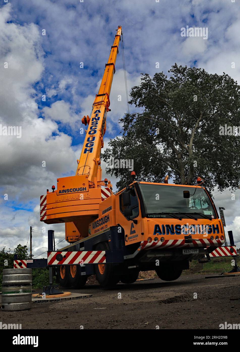 A Ainscough’s crane set up in the car park of the Slipway pub on Crabtree Lane near Burscough to lift the bridge balustrade of the canal swing bridge Stock Photo