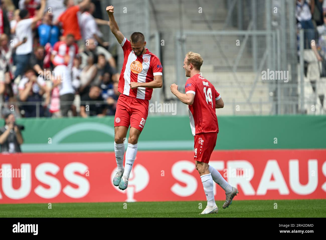 Essen, Germany. 13th Aug, 2023. Soccer: DFB Cup, Rot-Weiss Essen -  Hamburger SV, 1st round, Hafenstraße stadium. Torben Müsel (l) celebrates  his goal to make it 1:1 with Lucas Brumme. Credit: Federico