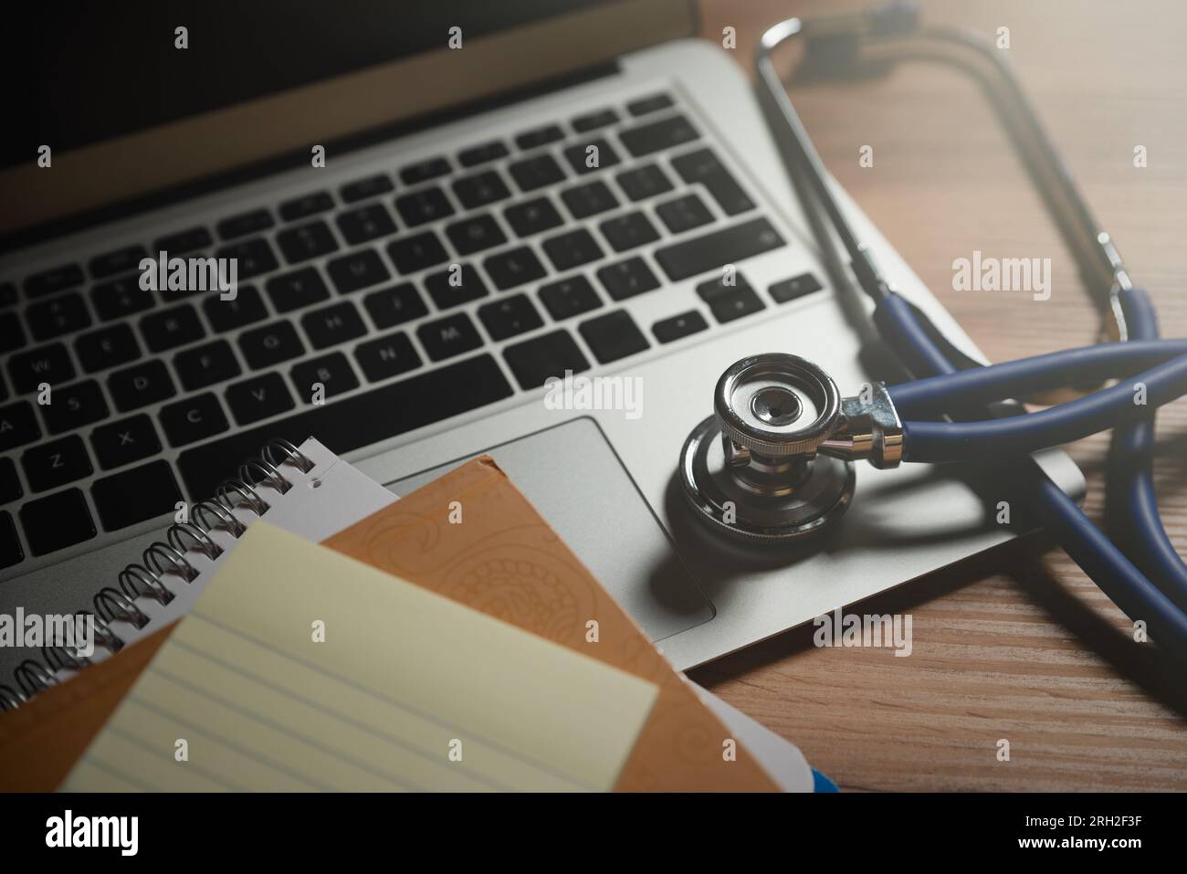 Doctor workplace with a stethoscope and laptop. Telehealth concept Stock Photo