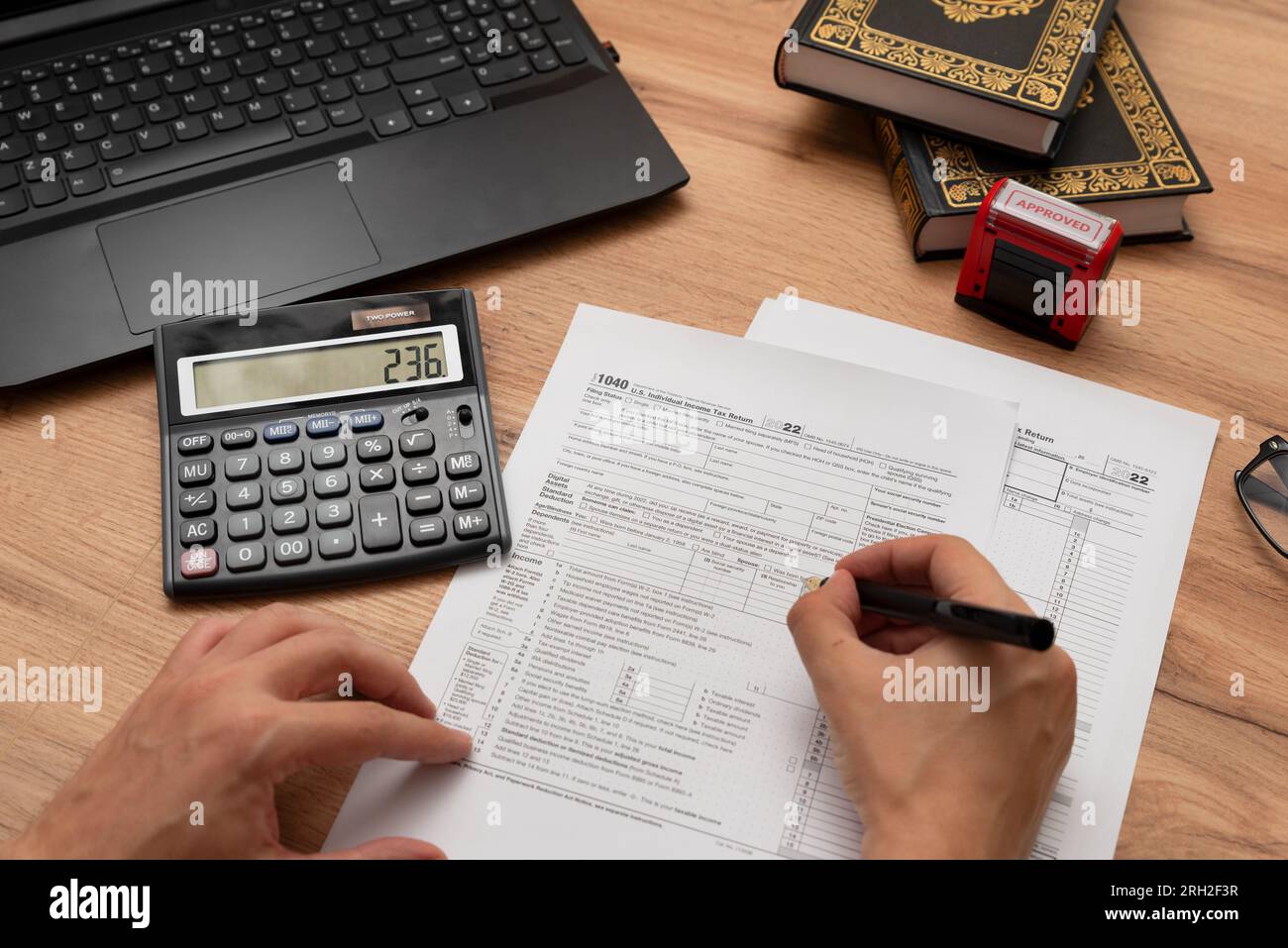 Man filling US tax forms, individual income tax return form Stock Photo ...