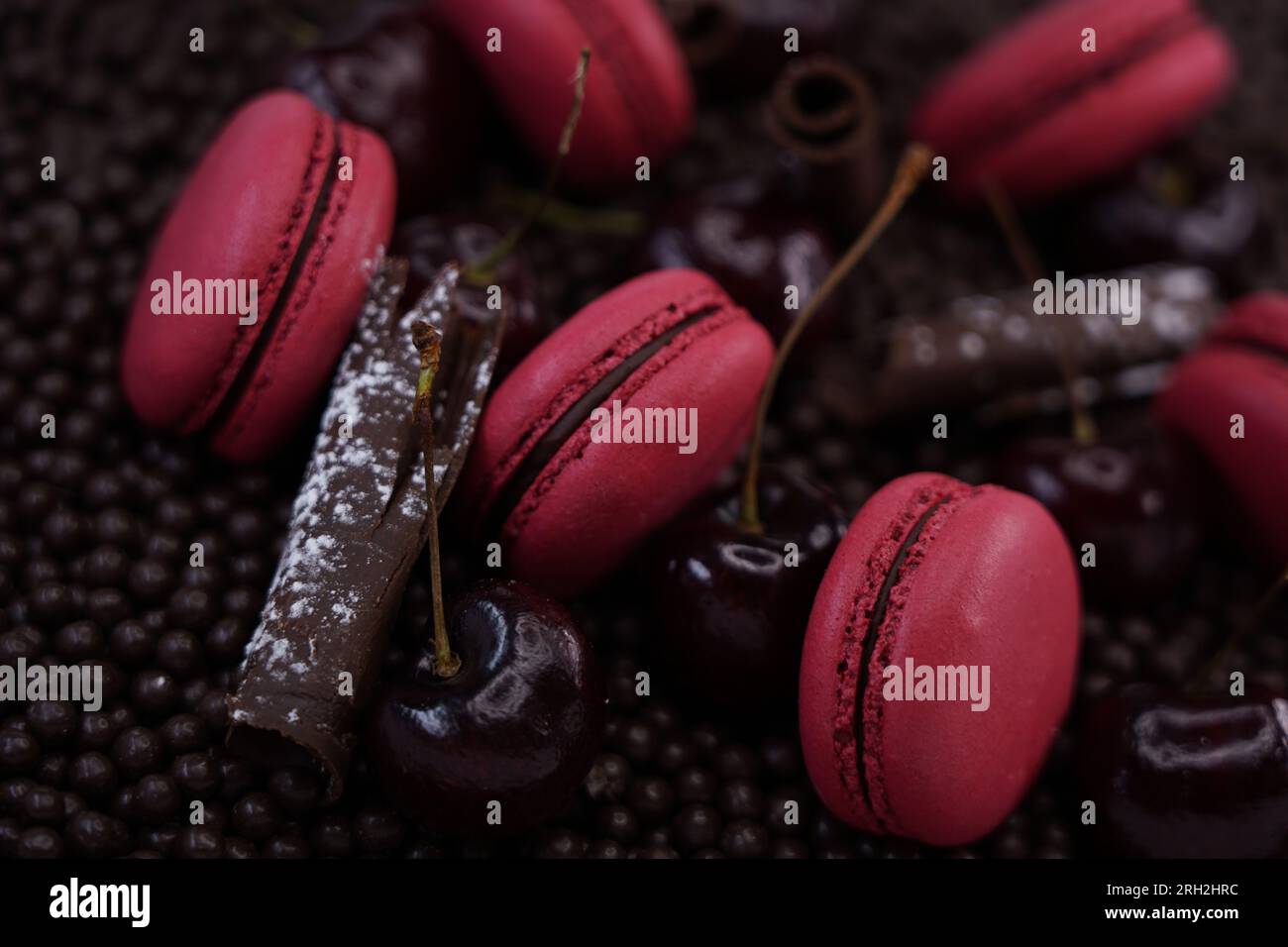 raspberry macaroons on chocolate background Stock Photo