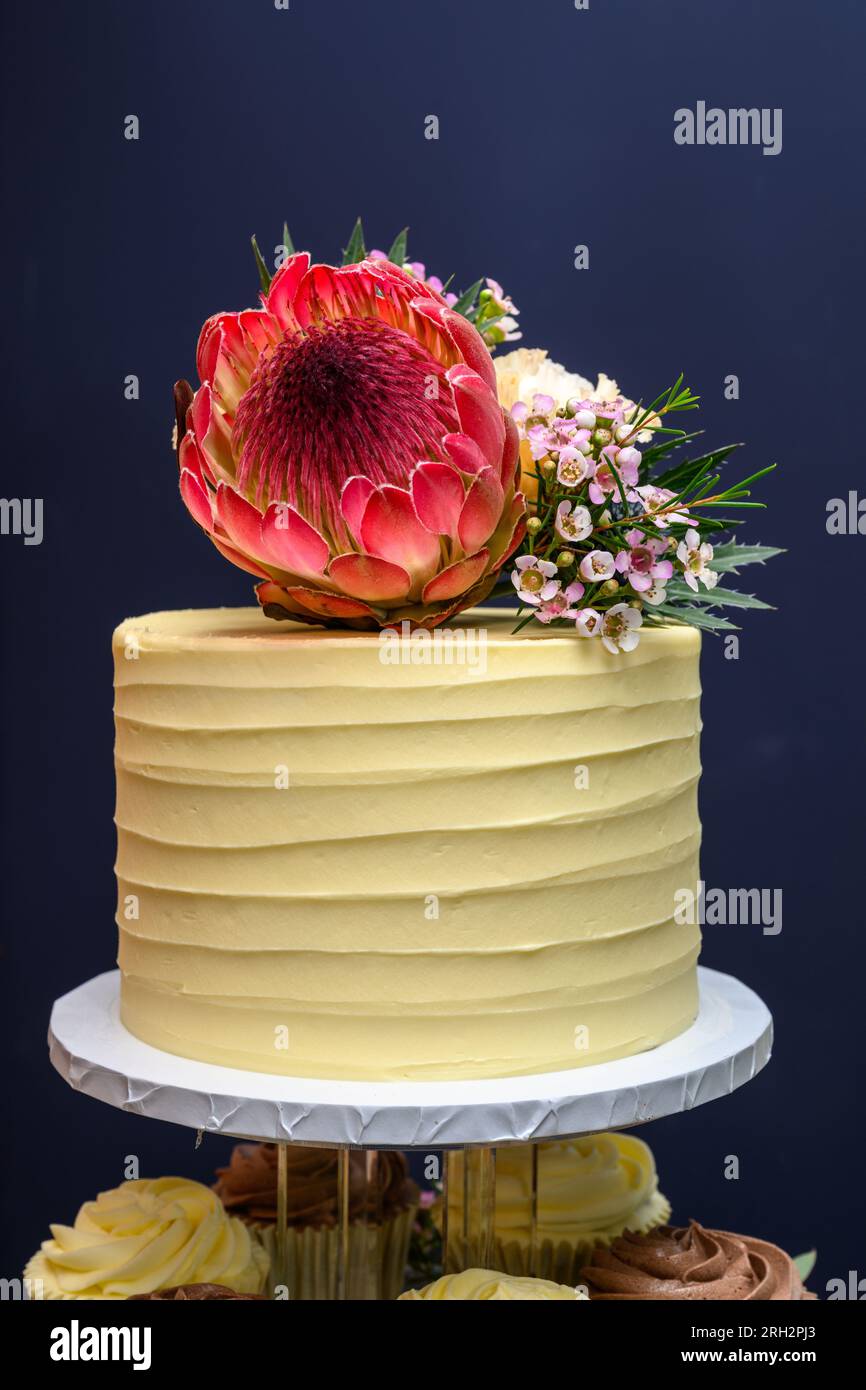Wedding cake fresh flowers isolated Stock Photo
