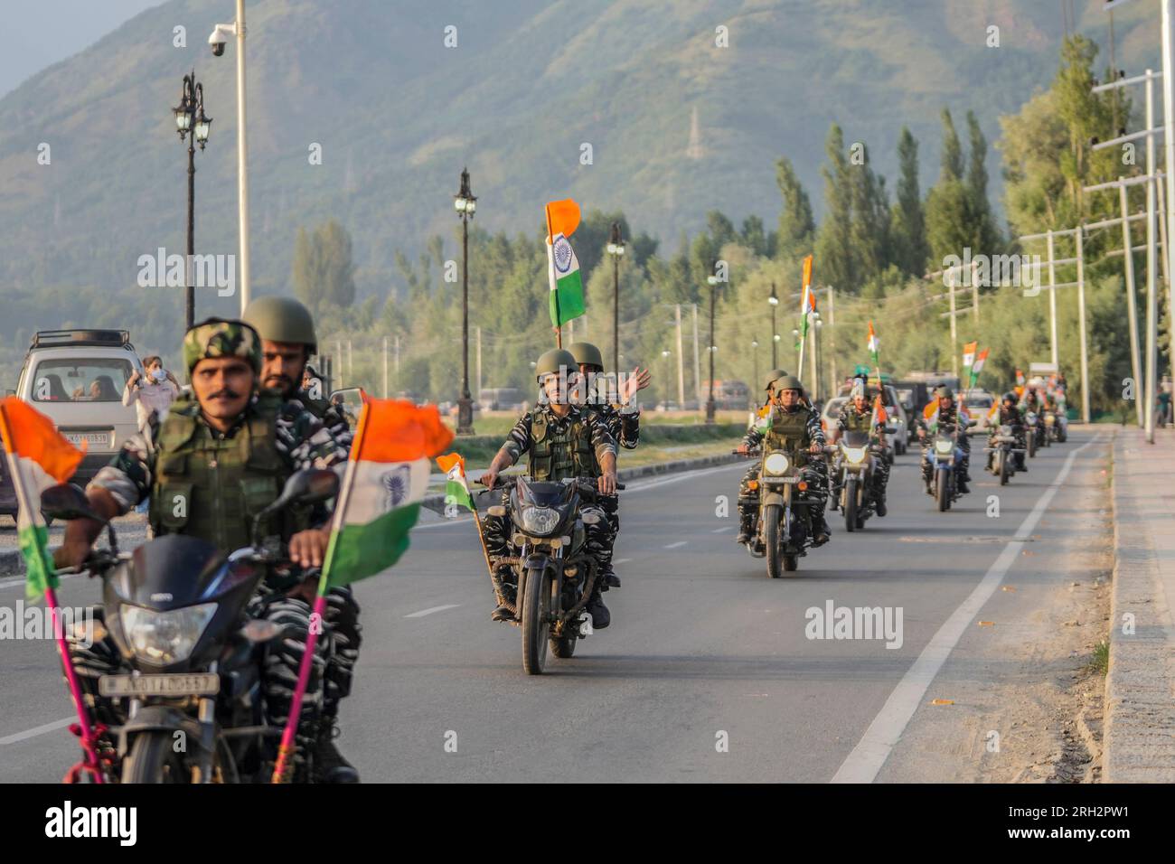 Indian paramilitary soldiers participate in a motorcycle rally ...