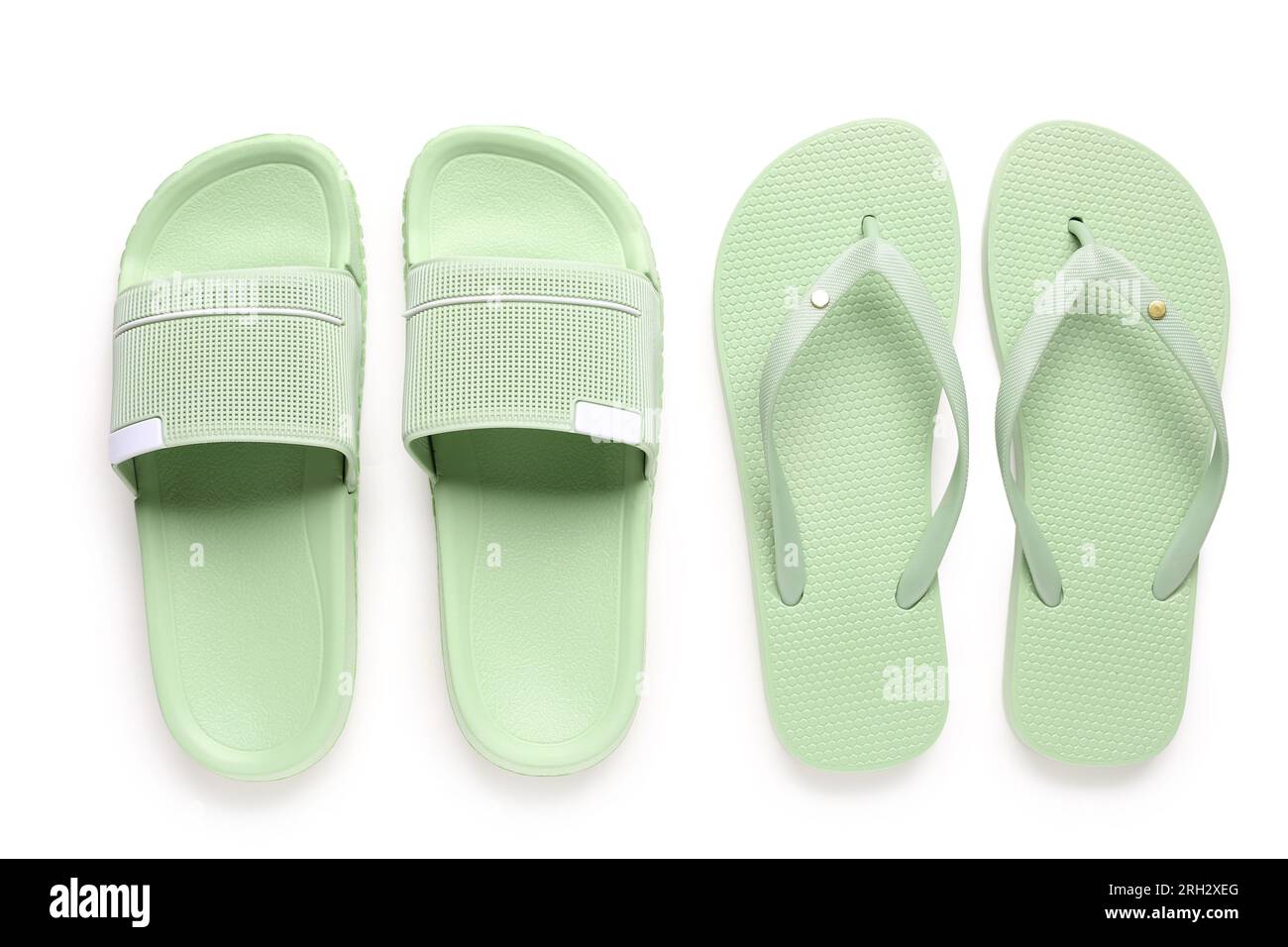 Colorful pairs of female flip flops on white background Stock Photo - Alamy