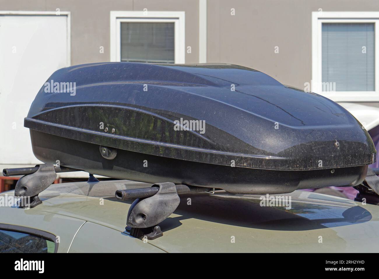Large black aerodynamic cargo box at car roof Stock Photo Alamy