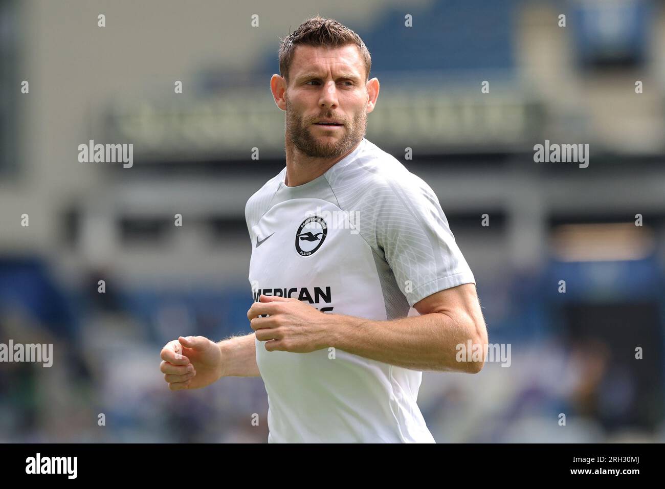 James Milner warms up for Brighton & Hove Albion at the AMEX Stadium Stock Photo
