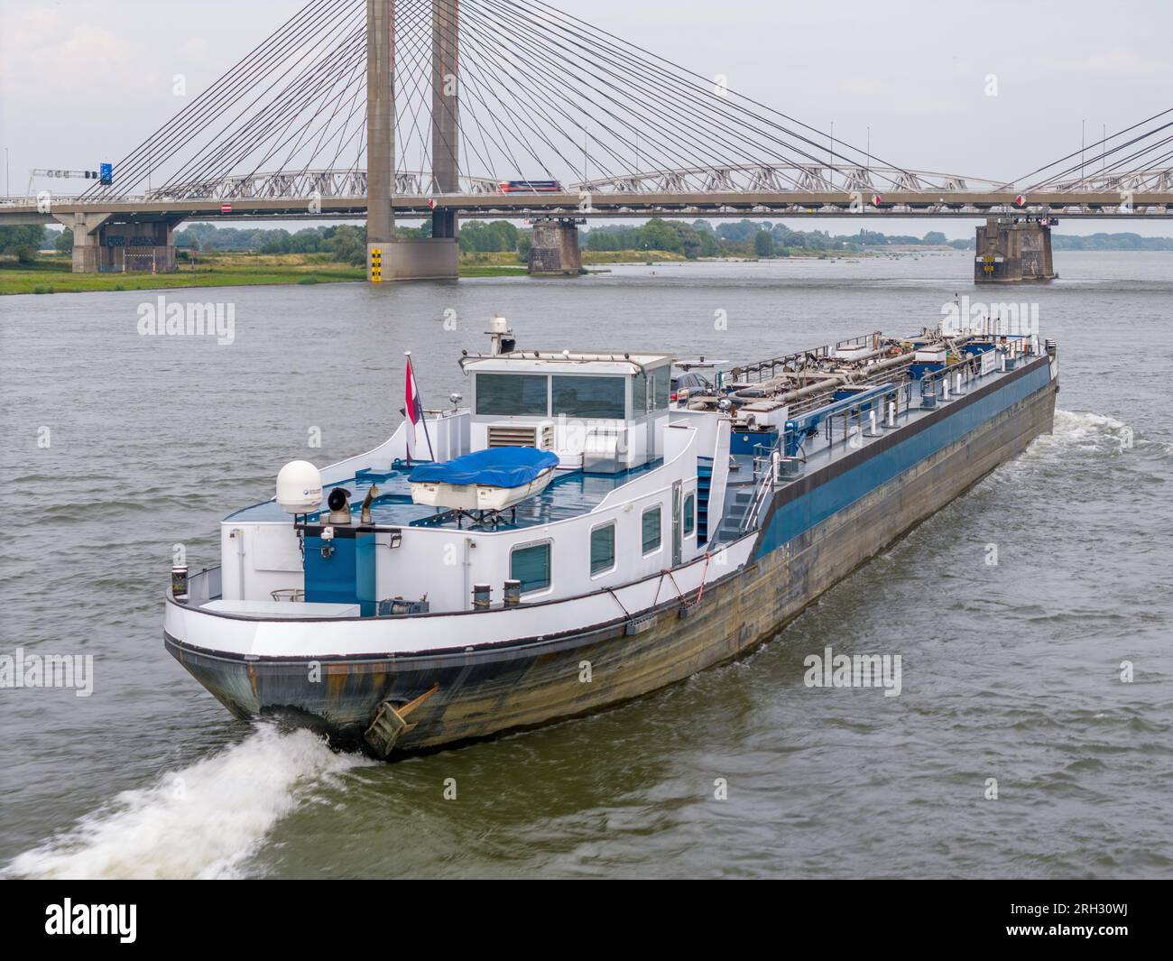 Aerial drone photo of a cargo ship on the river Waal in the Netherlands Stock Photo