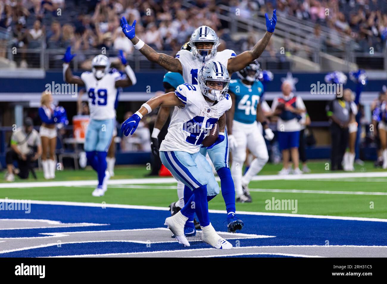 Dallas Cowboys running back Deuce Vaughn (42) runs with the ball during an  NFL pre-season football game against the Seattle Seahawks, Saturday, Aug.  19, 2023 in Seattle. (AP Photo/Ben VanHouten Stock Photo 