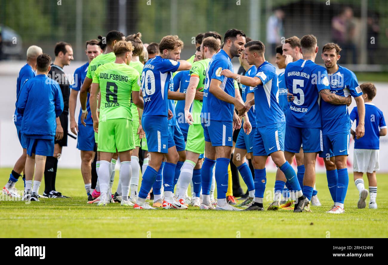 Makkabi players highfive Wolfsburg's team after the German Soccer Cup(01)
