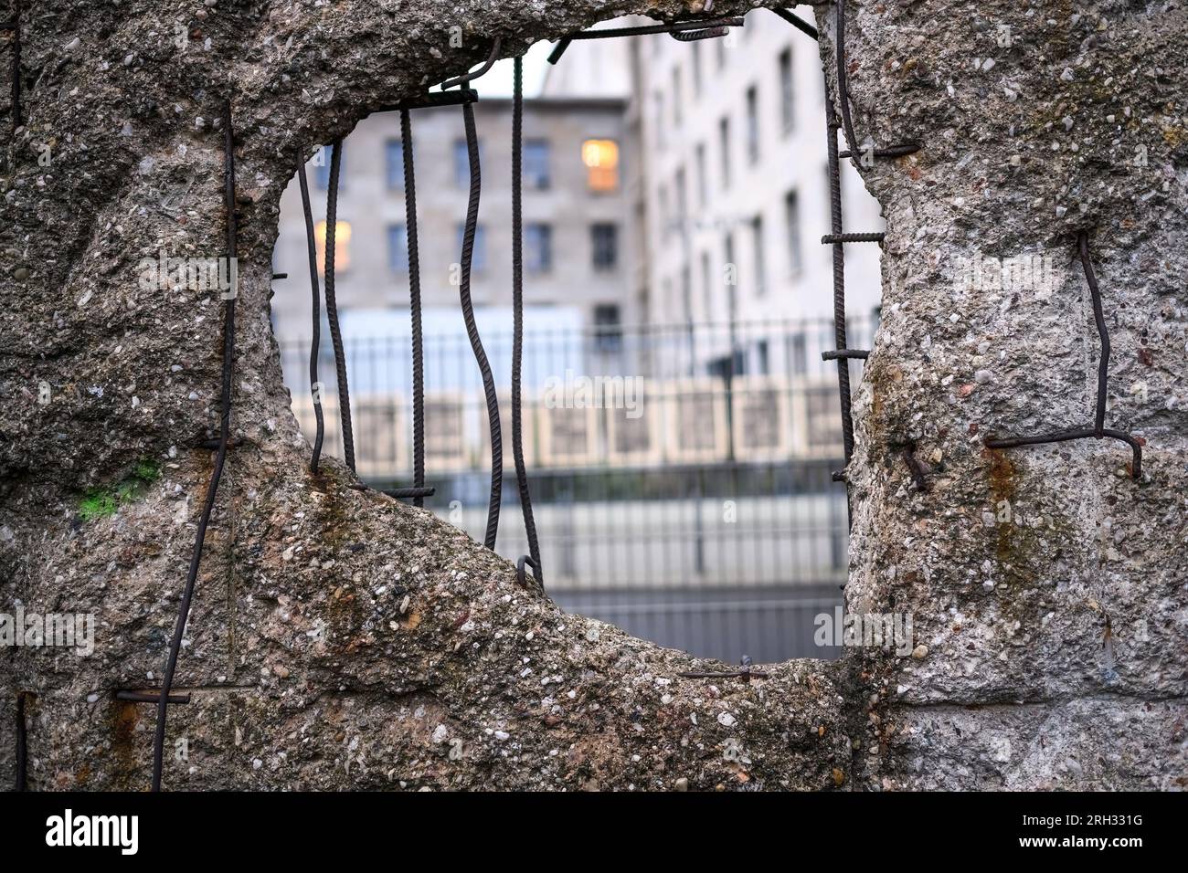 Hole in Broken Berlin wall between East and west Berlin, symbol of the