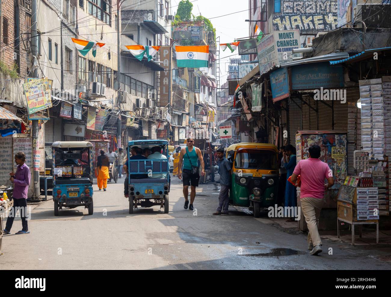 NEW DELHI - SEPT 17: Main Bazaar or Paharganj street with local people, transport and shops in New Delhi on September 17. 2022 in India Stock Photo