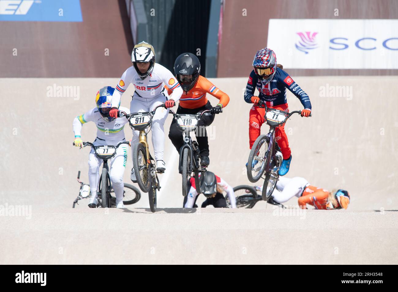 Glasgow BMX Centre, Glasgow, Scotland, UK. 13th Aug, 2023. UCI Cycling World Championships BMX Racing Women's Elite Final - GB's Bethany Shriever wins gold Pictured: Shriever stays clear of trouble as riders clash at the first jump and Manon Veenstra (6) and Zoe Claessens (2) fall Credit: Kay Roxby/Alamy Live News Stock Photo