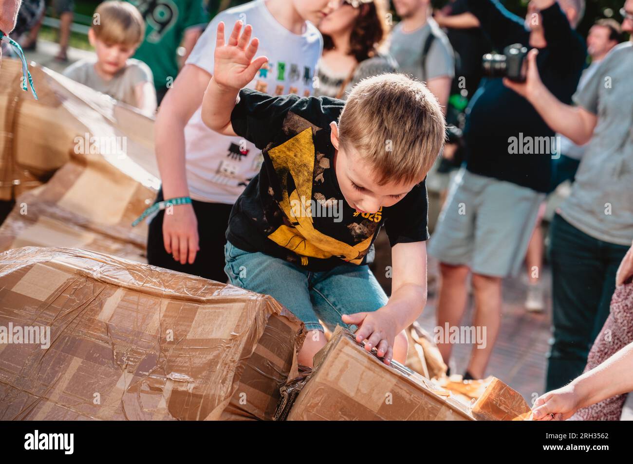 Newcastle upon Tyne, UK . Newcastle, UK. 13th Aug, 2023. The public take part in the Colossal Destruction of Olivier Grossetête's Monumental Construction at NOVUM Festival 2023. The structure was built from cardboard by the public at the start of the festival, and destroyed at the end. Credit: Thomas Jackson/Alamy Live News Stock Photo