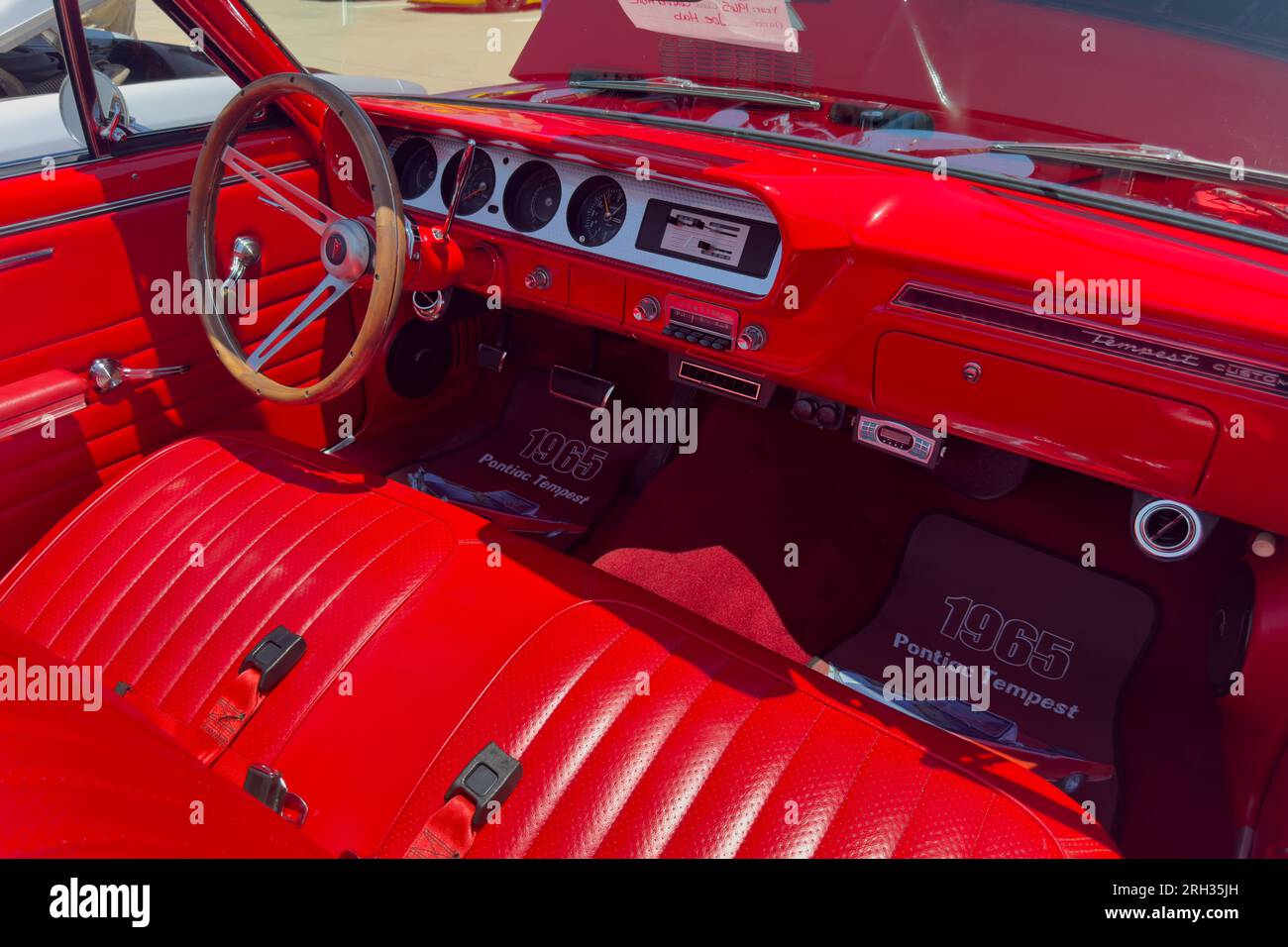 Little Elm, Texas - June 11, 2023: Interior of 1965 red Pontiac car at auto show. Stock Photo
