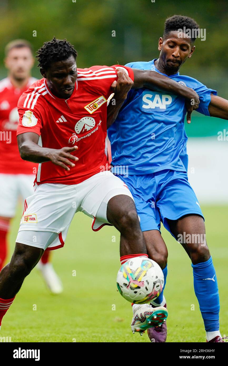 Walldorf, Germany. 13th Aug, 2023. Soccer: DFB-Pokal, Astoria Walldorf - 1. FC Union Berlin, 1st round, FC-Astoria-Stadion. Berlin's David Datro Fofana (l) and Walldorf's Boubacar Barry fight for the ball. Credit: Uwe Anspach/dpa - IMPORTANT NOTE: In accordance with the requirements of the DFL Deutsche Fußball Liga and the DFB Deutscher Fußball-Bund, it is prohibited to use or have used photographs taken in the stadium and/or of the match in the form of sequence pictures and/or video-like photo series./dpa/Alamy Live News Stock Photo