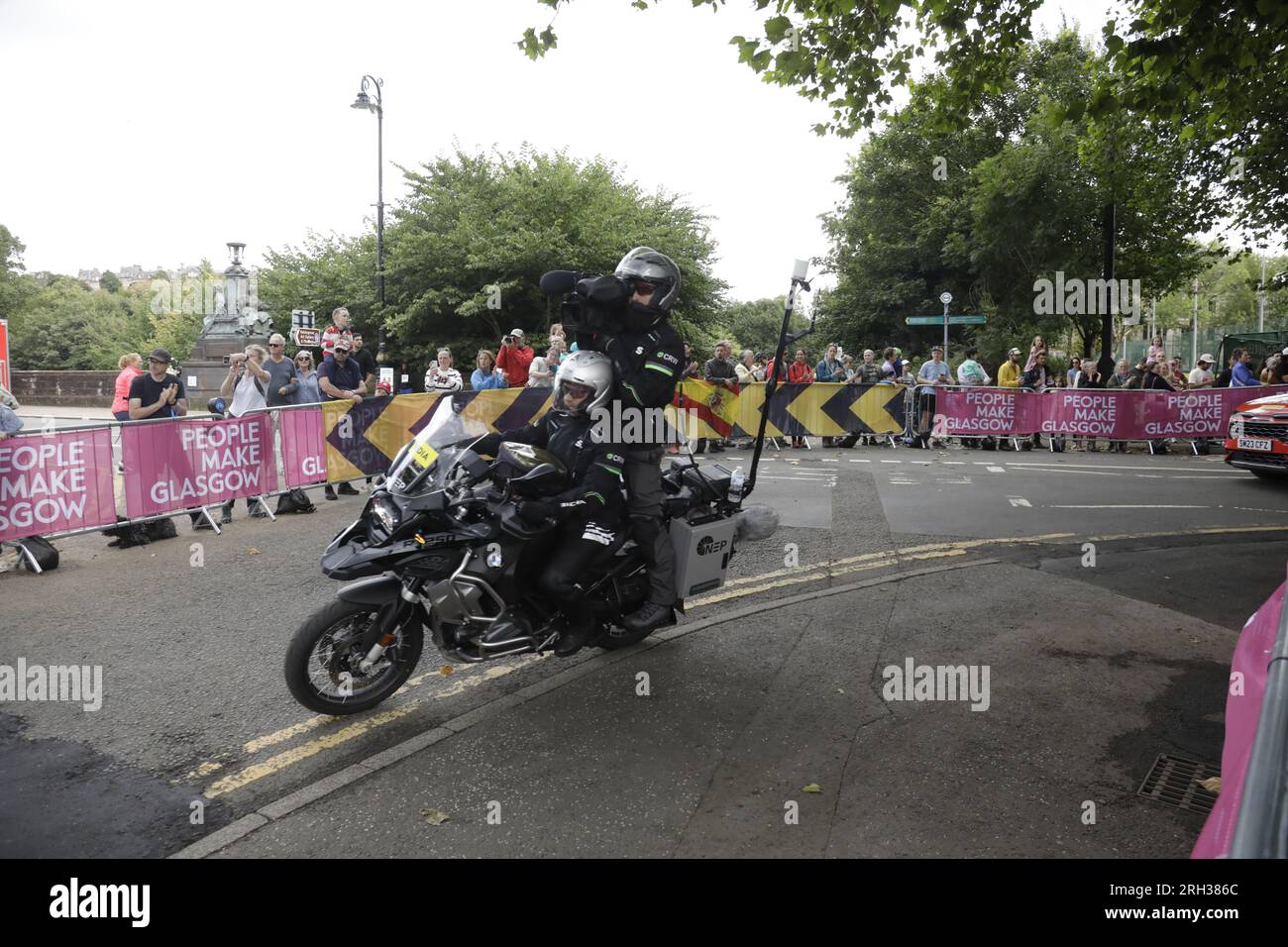 Official videographer filming from the back of a media motorcycle in Kelvingrove Park during the UCI Cycling World Championships Women Elite Road Race, lasgow, Scotland, UK. 13th August 2023 Credit: Elizabeth Leyden/Alamy Live News Stock Photo