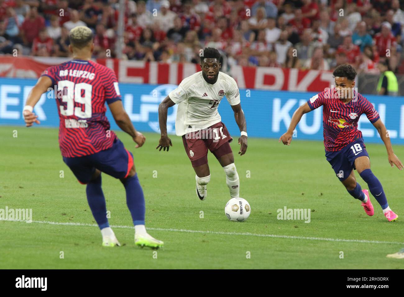 MUNICH, Germany. , . 19, Alphonso Davies of Fc Bayern Muenchen vs 18 Fäbio Carvalho, Faebio, of RB Leipzig during the Supercup Football match between Fc Bayern Muenchen and RB LEIPZIG at the Allianz Arena in Munich on 12. AUGUSTR 2023, Germany. DFL, Fussball, 0:3 (Photo and copyright @ ATP images/Arthur THILL (THILL Arthur/ATP/SPP) Credit: SPP Sport Press Photo. /Alamy Live News Stock Photo