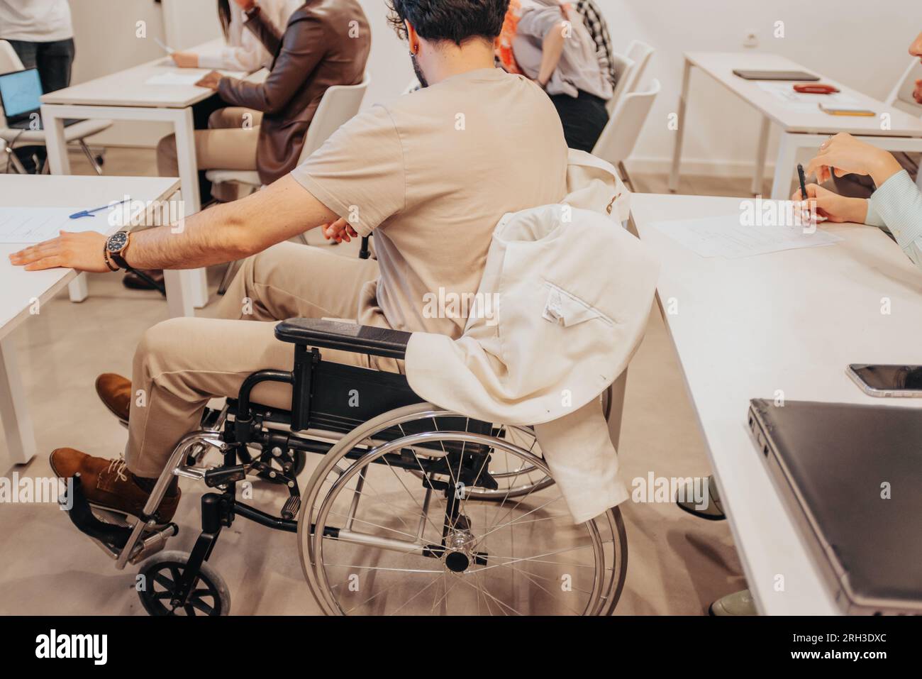 Disabled man in wheelchair. Disabled employee. Handicapped male person ...