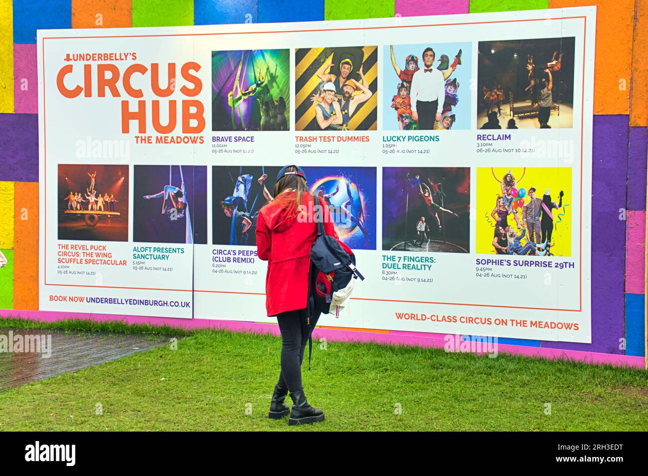 Edinburgh, Scotland, UK. 13h  August, 2023. UK Weather:  Circus hub on the meadows popular bar and food as well as clowns. Warm and wet as tourists infested the streets of the city amongst the street fringe acts with their brollies . Credit Gerard Ferry/Alamy Live News Stock Photo