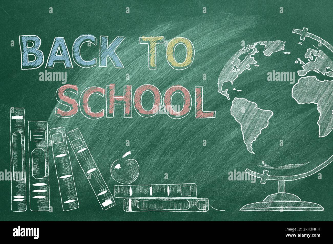 Hand drawn Back to School text on greenboard. Globe and school books ...
